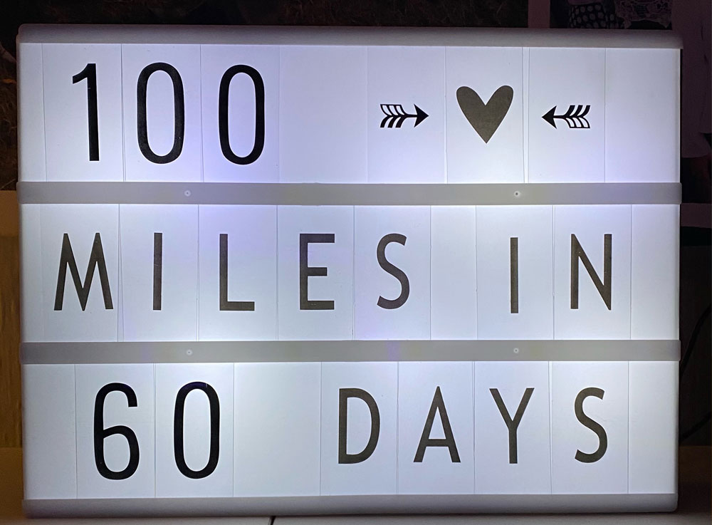Lightbox sign with 100 mile text
